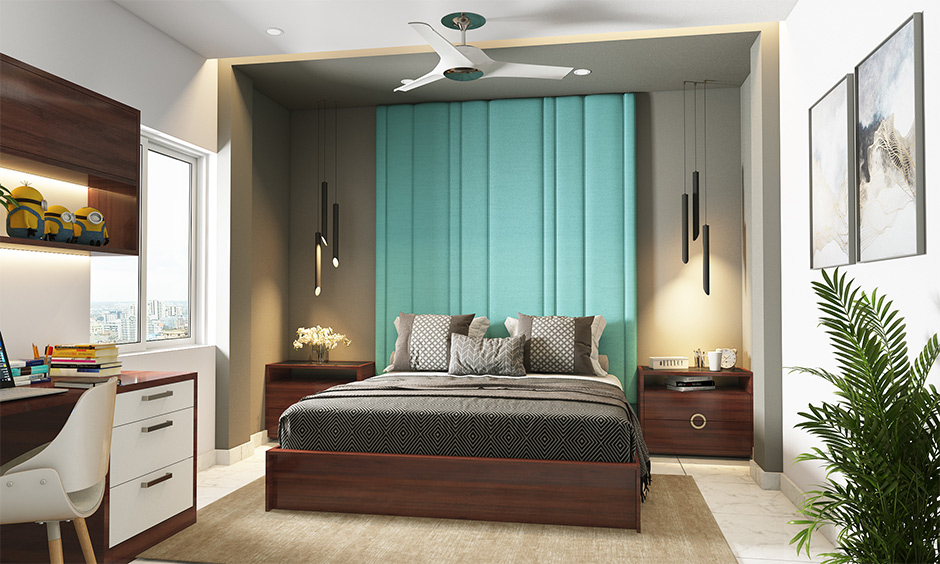 Combination with grey wall colour bedroom with teal headboard lends a striking look to space.