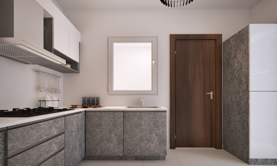 Contemporary kitchen design for a middle-class family in India with grey-marble cabinets complements the white walls.