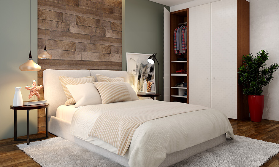 Rustic bedroom with light-coloured wood and a table lamp takes a warm feel