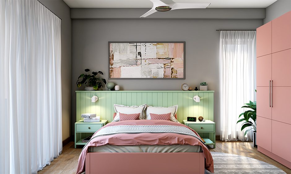 Wall colour grey combination with pastel shade for bedroom lends the space a calming and soothing ambience.