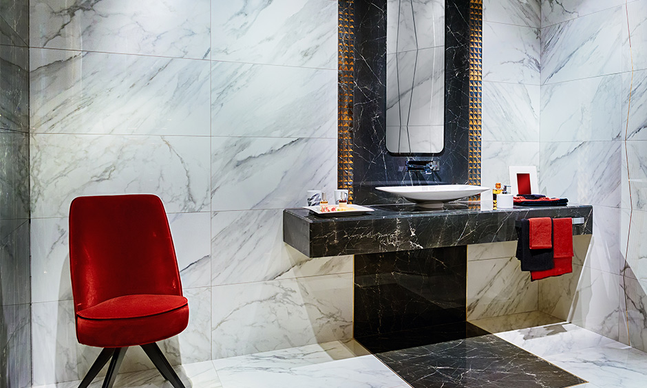 Red bathroom idea, White, grey and black marble bathroom with a pop of red furniture and accessories look classy.