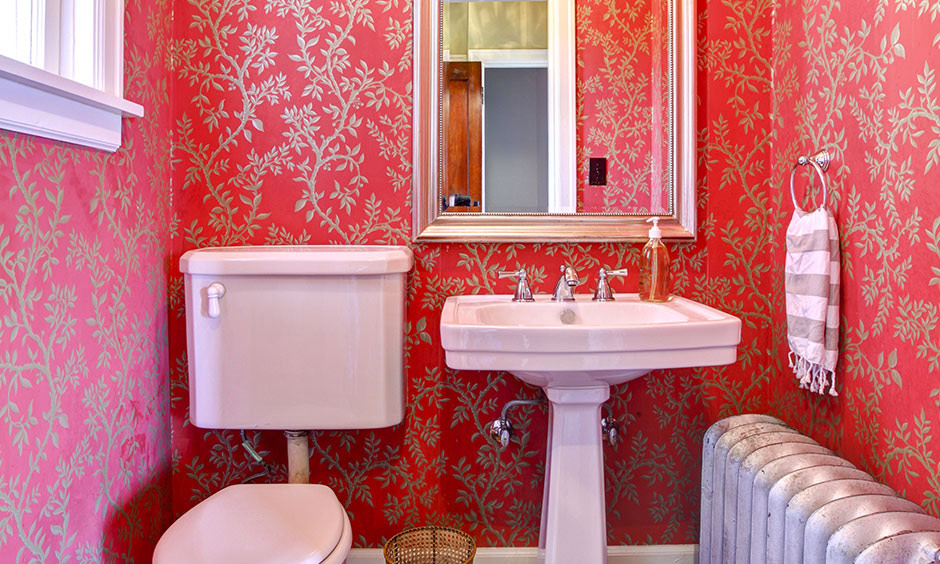 Red bathroom wallpaper works like a charm and instantly makes the room look royal.