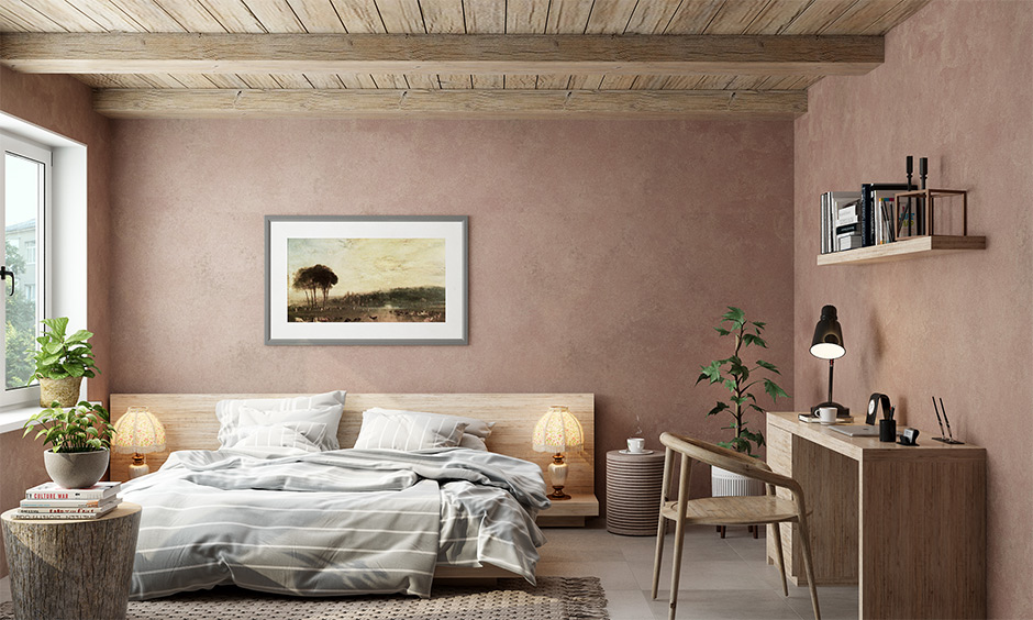 A Scandinavian bedroom decorated with light wooden furniture and ceiling brings an earthy look.