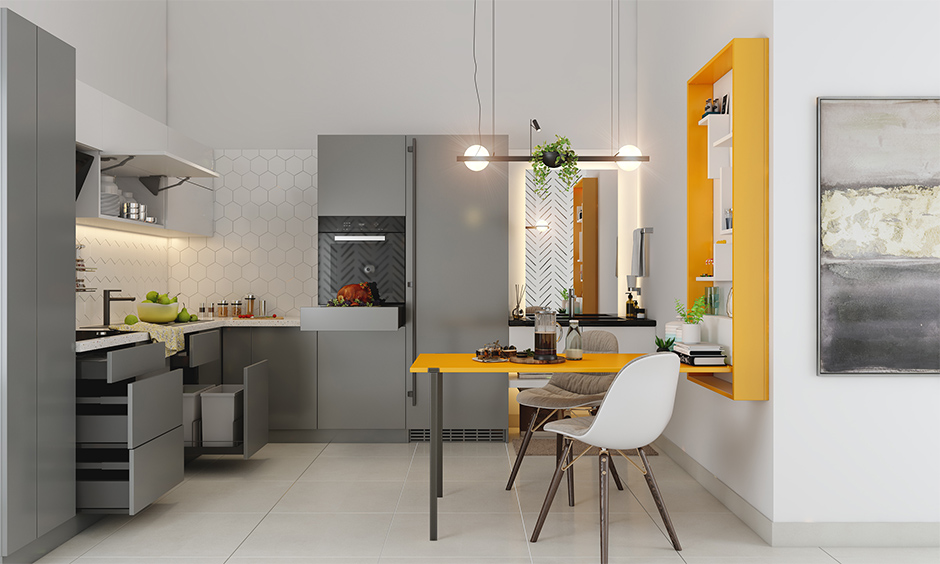 The modular kitchen with a folding dining table with hidden storage is an ingenious space-saving Scandinavian decor idea.