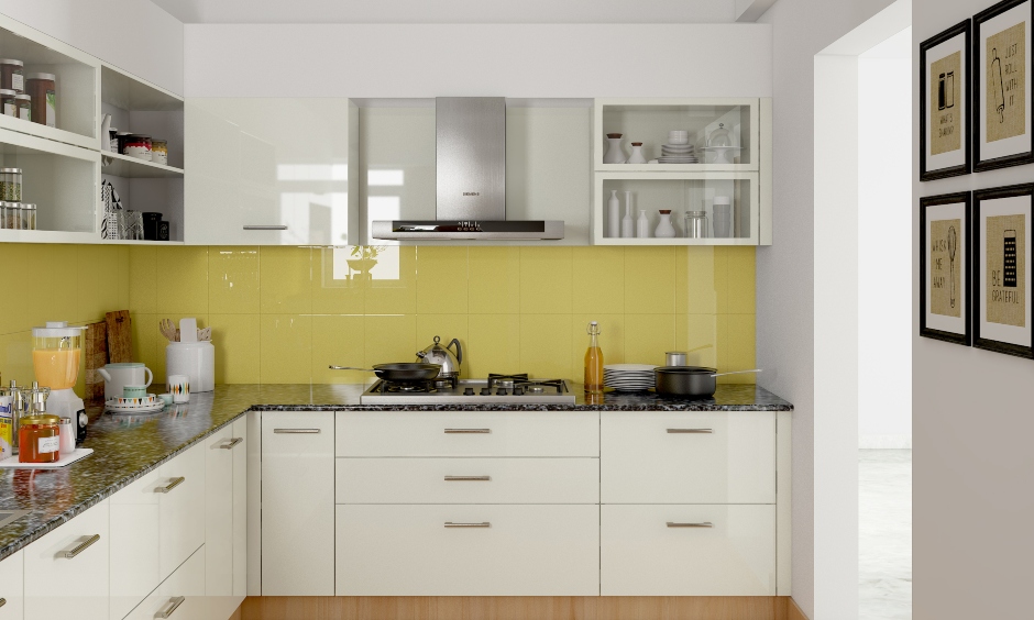 Simple Indian kitchen design for a middle-class family in yellow and white looks so lavish yet straightforward.