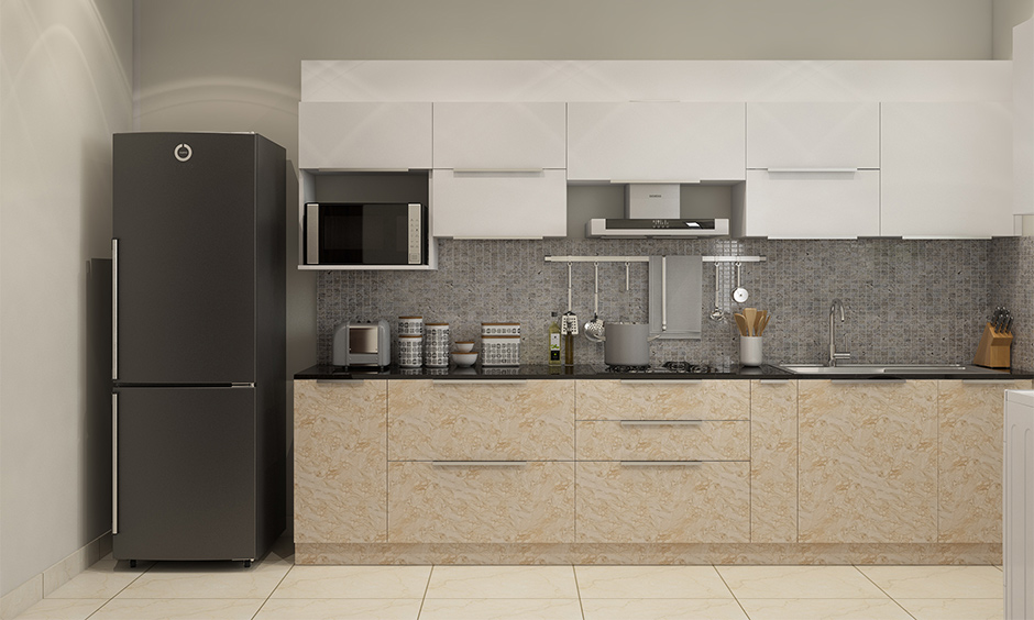 A compact grey modular kitchen with grey kitchen tiles for the backsplash