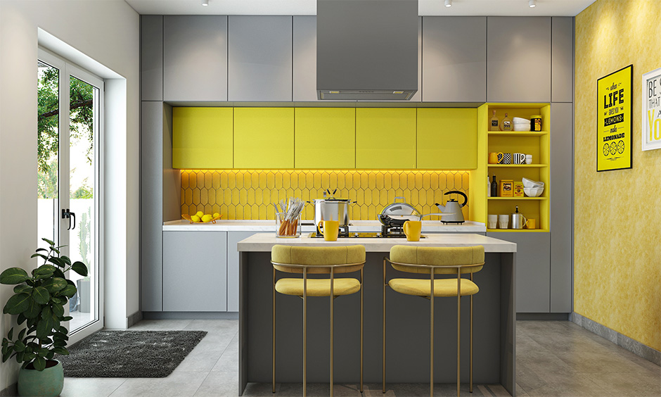 A grey modular kitchen designed with pantone colour combination and grey kitchen tiles