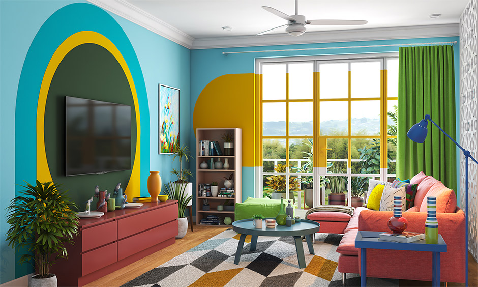 A colorful boho living room with a large balcony window brings ample sunlight.