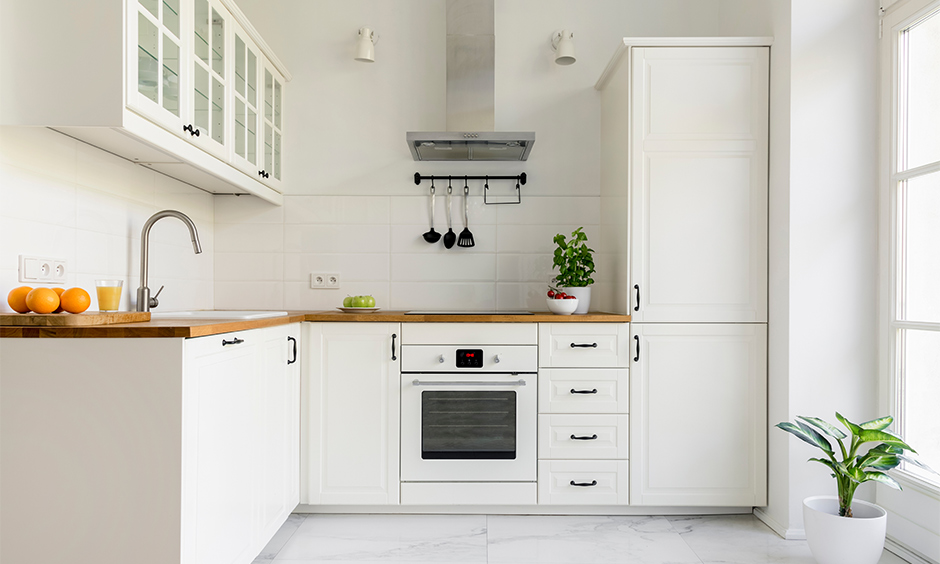 French kitchen in retro cum contemporary look with french kitchen cabinets and rustic chimney