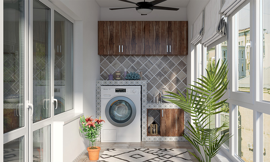 Decorative laundry room in balcony with a wooden base cabinet with a vessel sink looks elegant.