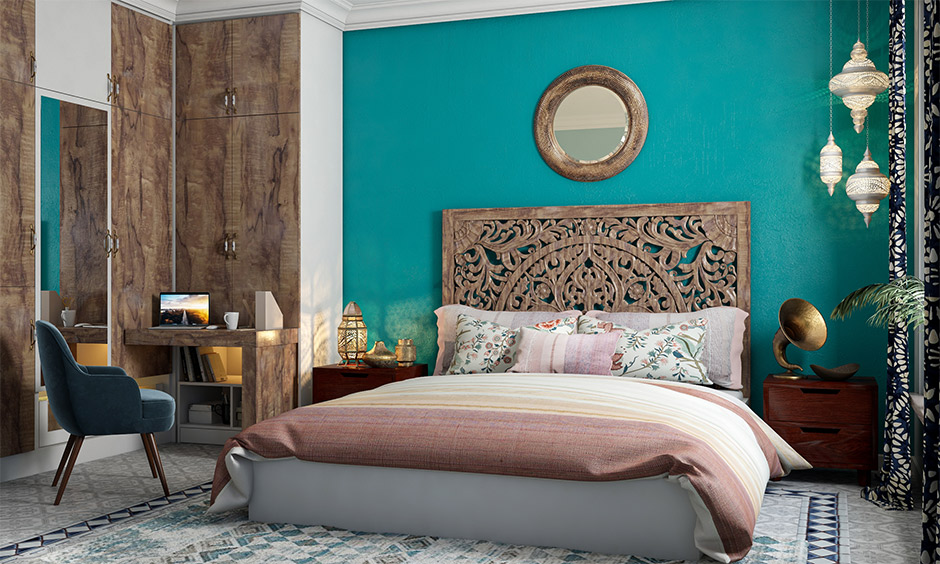 Moroccan inspired interior design bedroom with headboard, side table and lamp in Moroccan style.