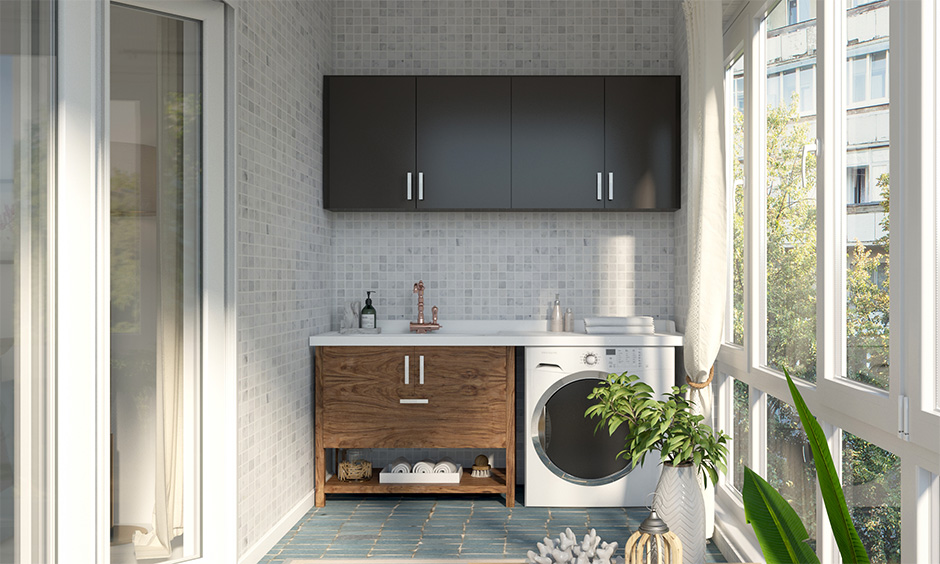 The laundry room idea for a small balcony with a cabinet and wall tiles gives a delightful feel.