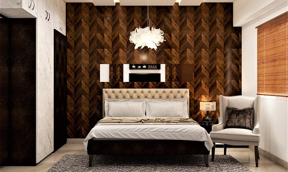 Designer bed for bedroom with a herringbone-patterned wooden accent wall