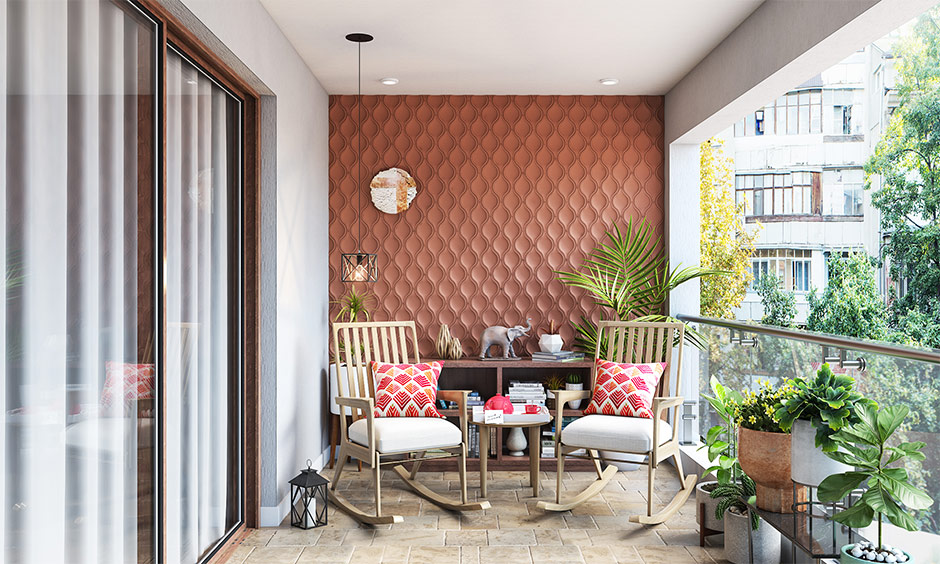 An apartment balcony with wooden rocking chairs with a simple table is a unique outdoor furniture idea.