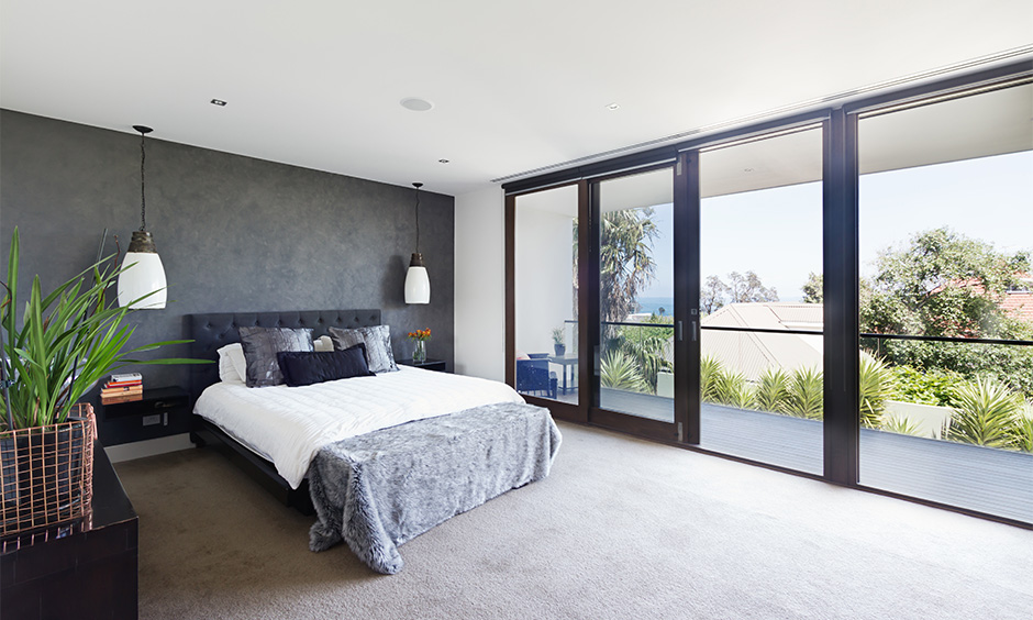 Glass wall bedroom with an astonishing view to bring in a splash of nature to your home interiors