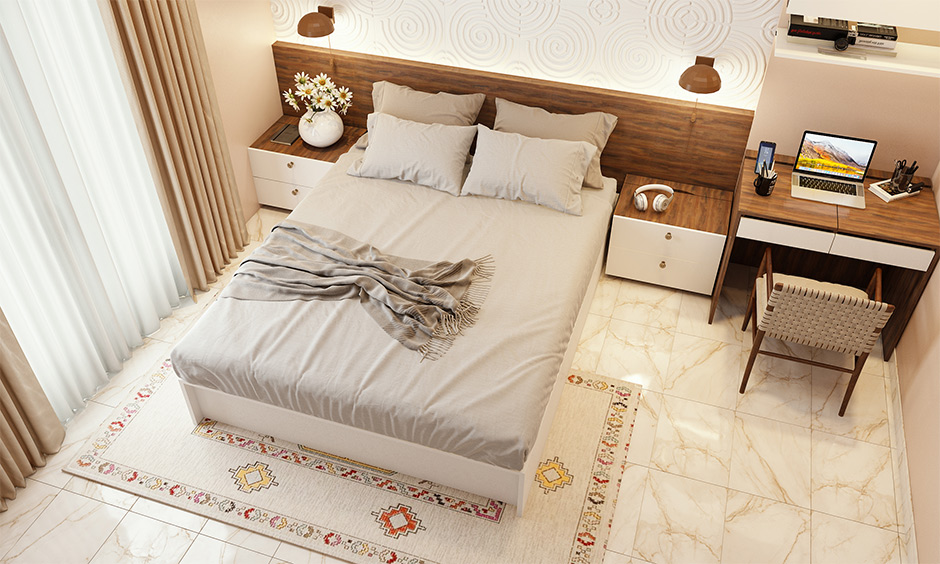 The bedroom with traditional Indian decor rugs gives an Indian touch to space