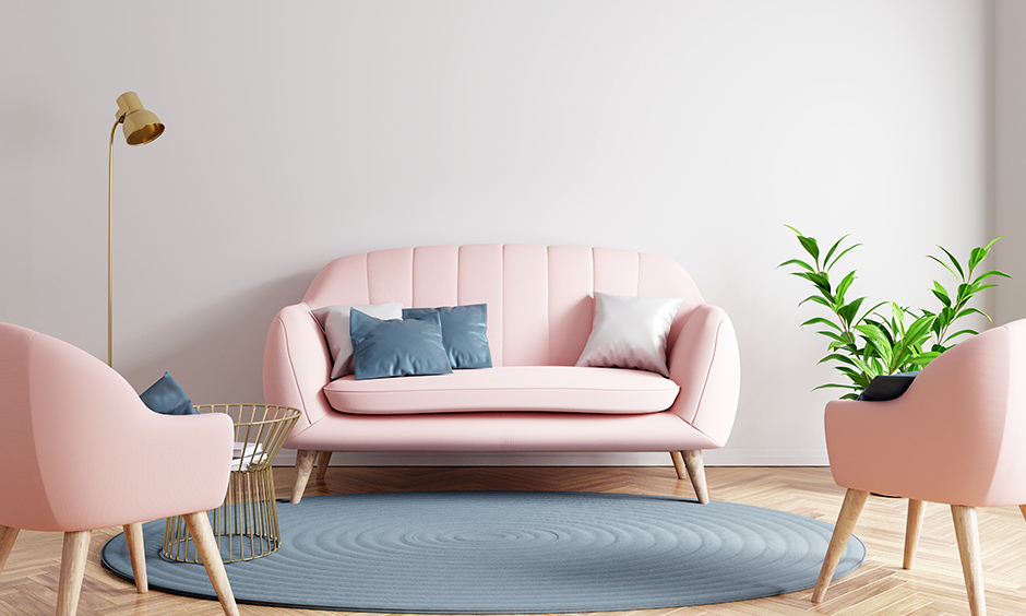 Cushiony baby pink loveseat with two single sofa chairs