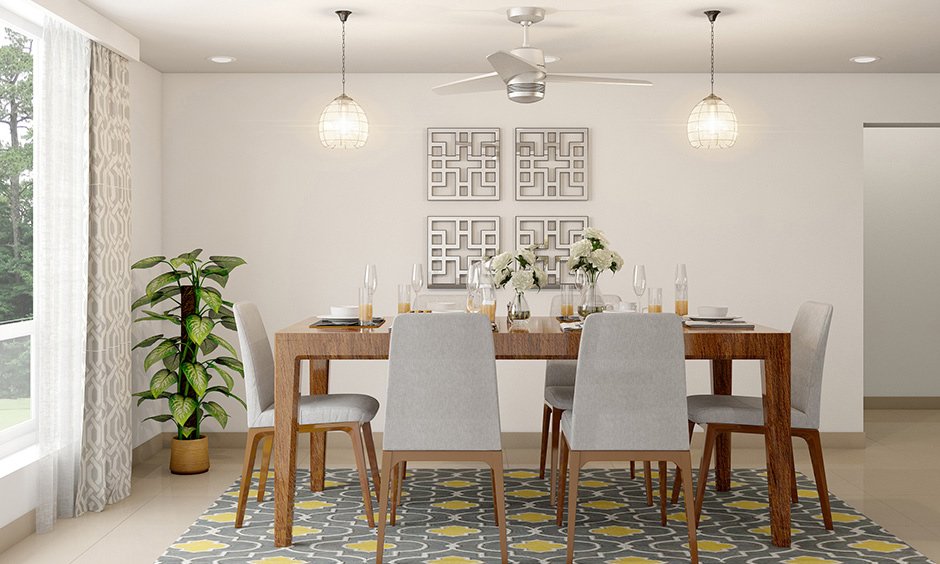 Dining area has a pair of dome-shaped glass hanging lights that are the perfect for ceiling