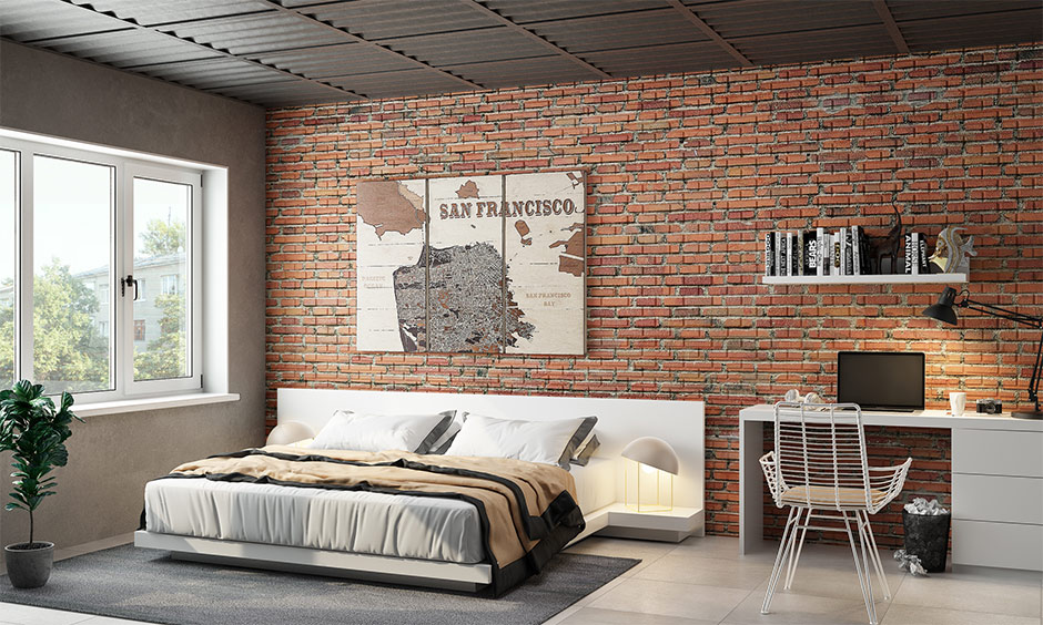 Industrial loft style bedroom has a study unit and brick cladding wall design