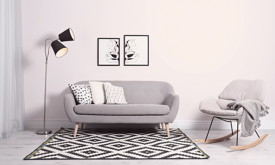 A grey loveseat in mid-century style with a side armchair is perfect for small living areas