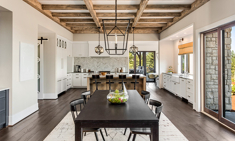 Rustic solid wood dining table in kitchen cum dining space makes the focal point of the room