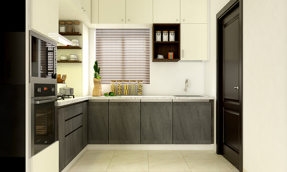 An l-shaped kitchen with a wall-mounted kitchen faucet provides more space for the kitchen sink
