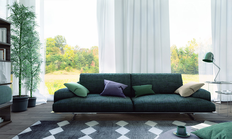 Wide sectional loveseat in the green cotton fabric in the living room