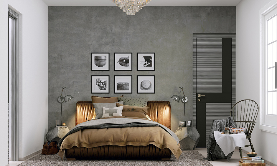 Industrial bedroom design in grey with black and white picture frames on it