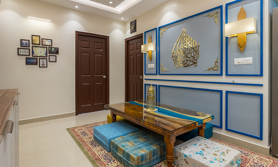 Moroccan traditional dining table with floor cushions and decorative legs blends with the theme