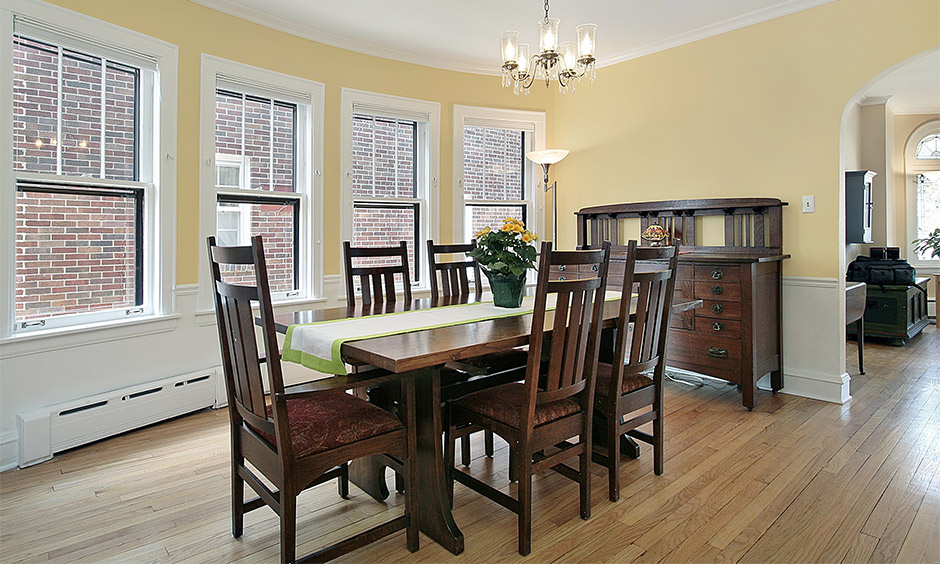 Traditional dining table design in teak wood comes with five high back chairs with maroon decorative upholstery