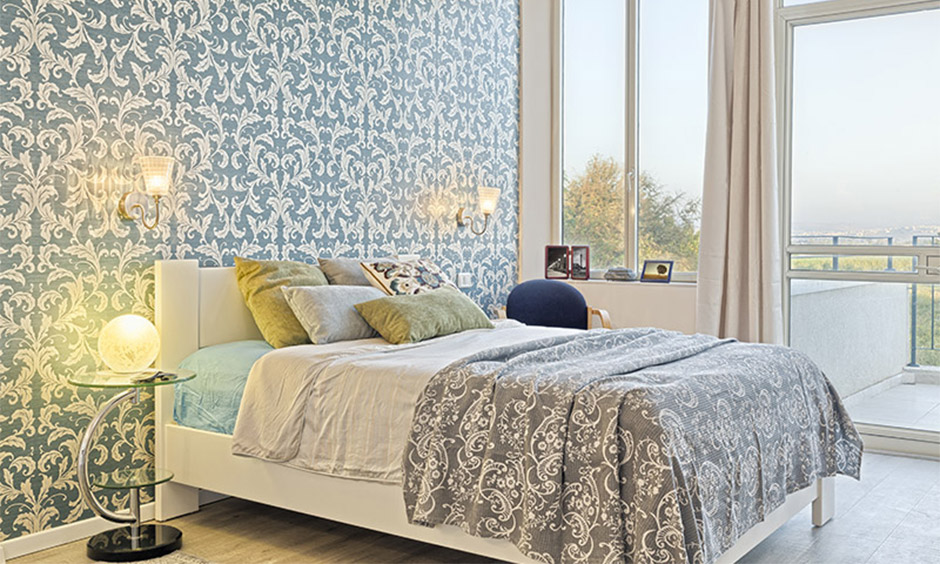 The vintage bedroom has a vintage style bedroom wallpaper on the wall and a hand-printed mattress accentuate retro appeal