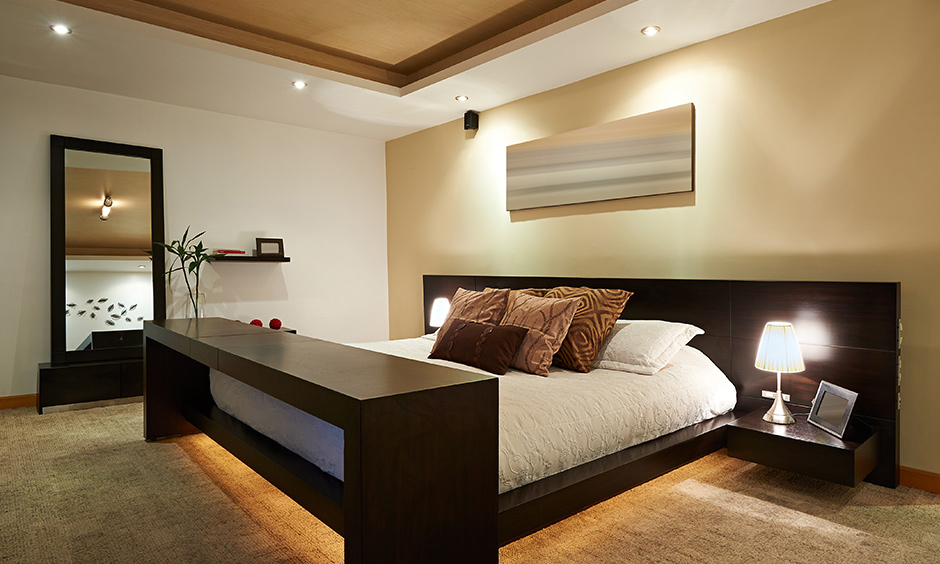 A simple elevated bedroom wooden false ceiling which keeps things simple in the bedroom