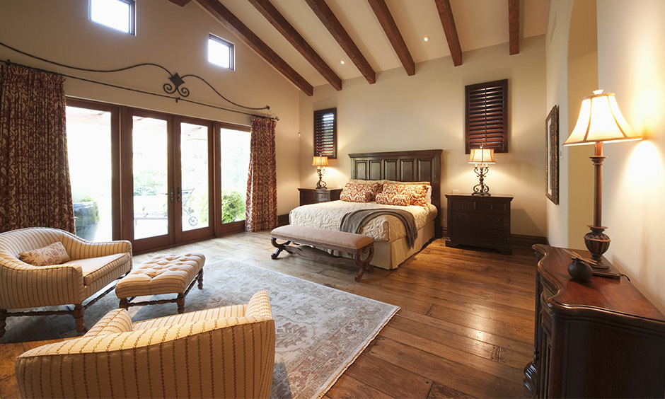 A traditional bedroom wooden false ceiling for master bedroom where you pick the same shade for your wooden false ceiling