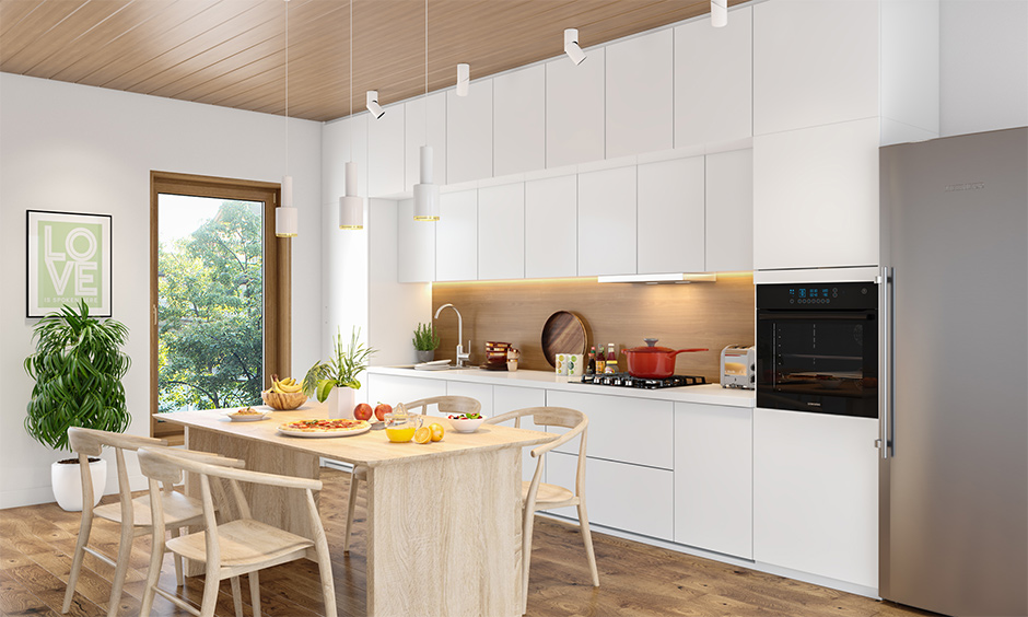 A minimalistic modular kitchen with loft and wooden flooring makes the place appear bright and lively