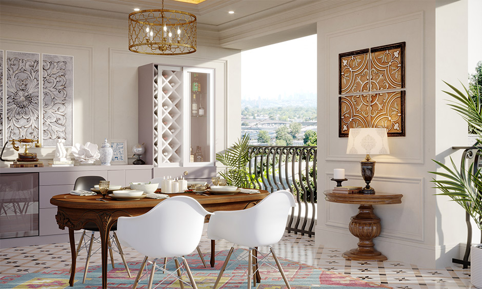 A victorian-style dining table with modern bucket chairs is the perfect modern victorian dining room idea