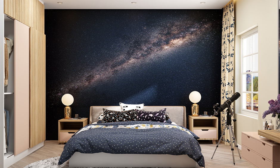 Outer space theme decorations for the bedroom with a milky way galaxy wallpaper gives an outer space vibe