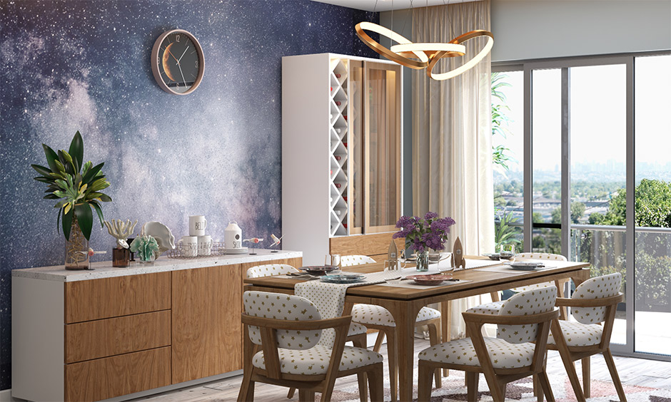 Space themed party decorations idea for dining space with milky way galaxy-themed wallpaper