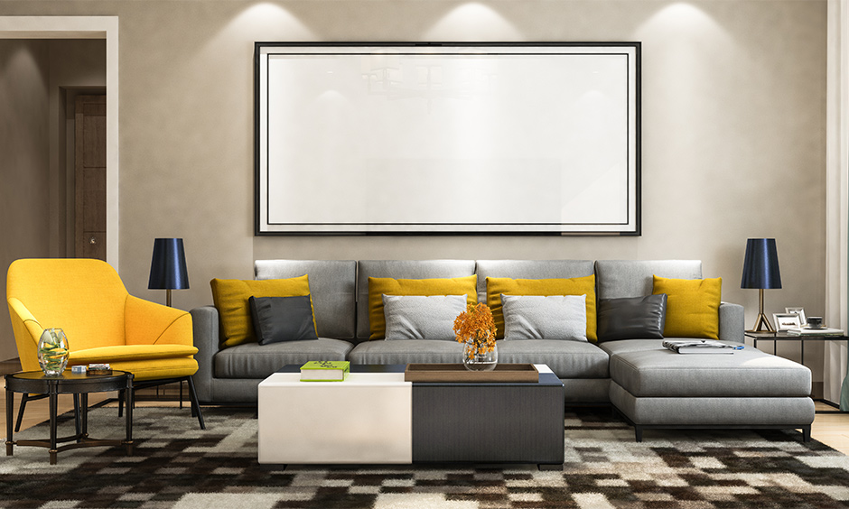 An l shaped sectional sofa with yellow accents to add some vibrance