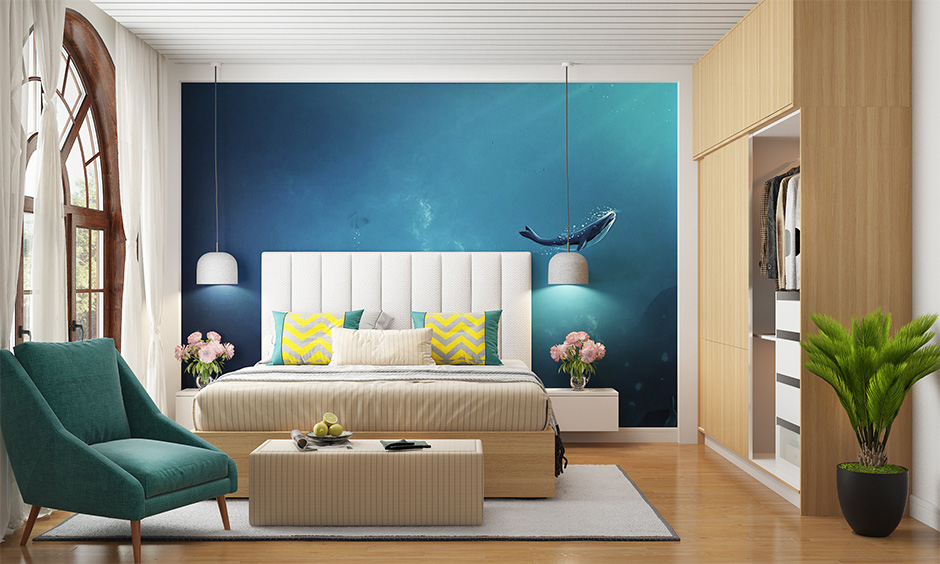 Beach themed bedroom decorated with ocean wallpaper is ideal for a simple yet attractive beach-themed bedroom on a budget