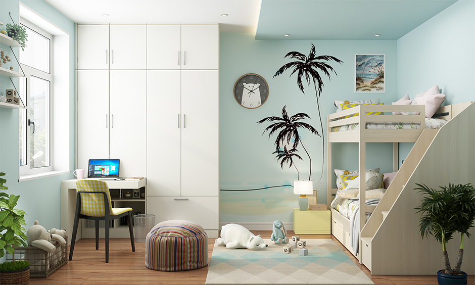 Beach themed kids bedroom with wall stickers and posters on the wall that will help infuse a subtle beach vibe