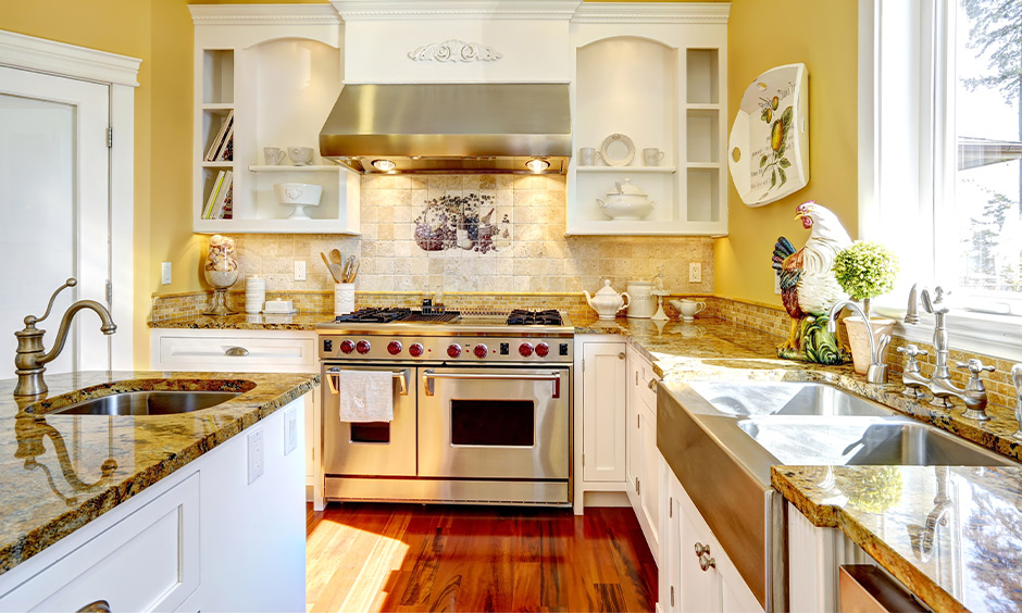 Jazz up your kitchen with this traditional white color combination with yellow wall