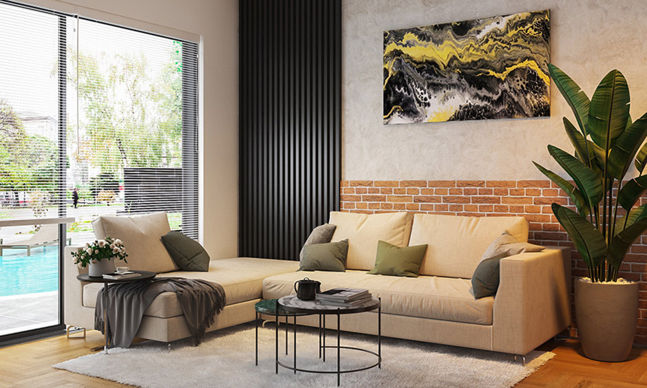 Living room trends 2022 are hot on black accents with an earthy backdrop