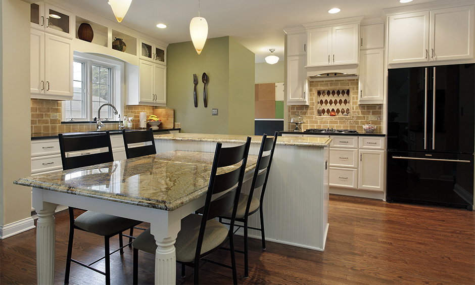 Granite top black and white dining table set in the kitchen cum dining area