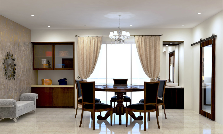 Black and white round dining table made of hardwood paired with upholstered chairs