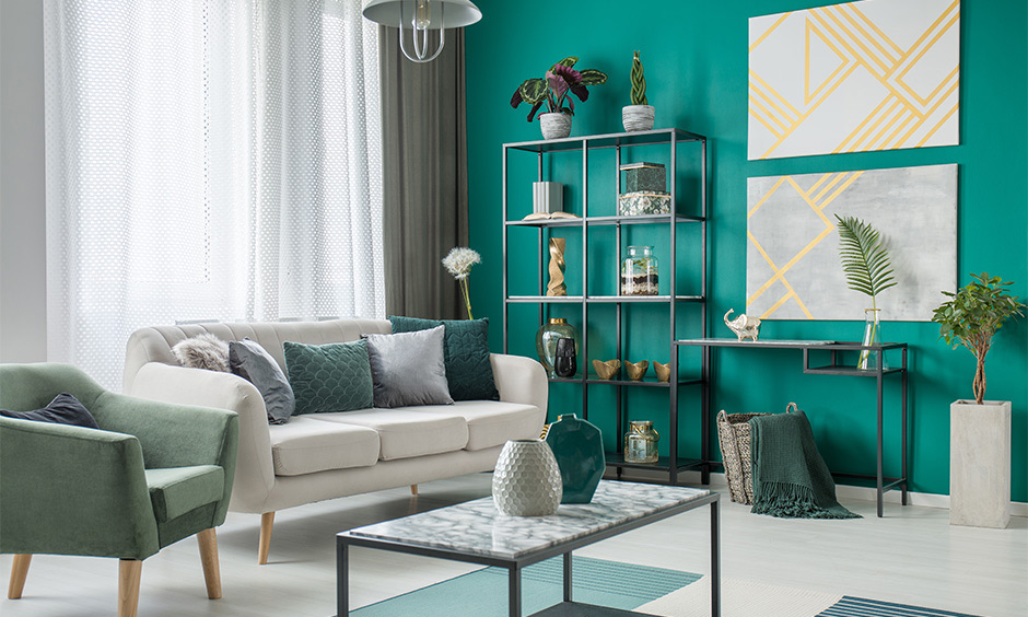 Teal bright living room paint idea with grey furniture and tinges of gold here and there lends classy and elegant