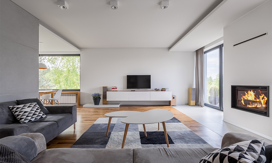 Darken up the floor of a dark grey and white living room