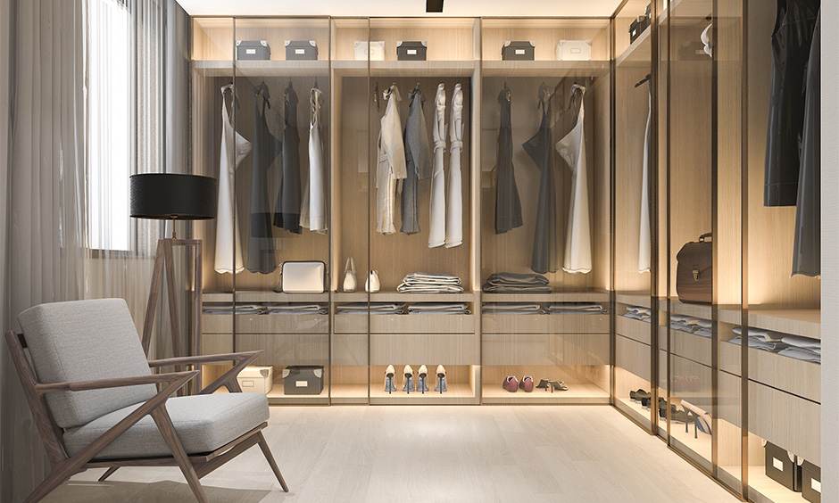 A wardrobe comes with shoe storage cabinets with mirror doors that lend a classy appeal