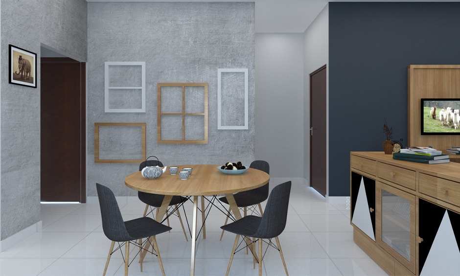 A dining room with black chairs against a grey wall lends a modern look