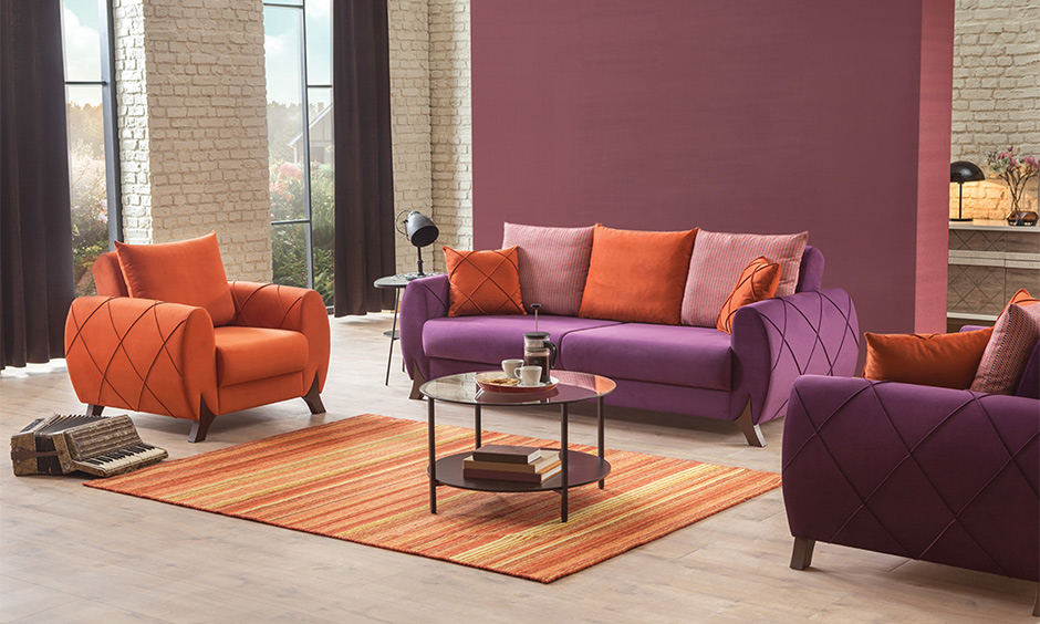 Bright colorful living room ideas add a pop of purple and orange for a royal look