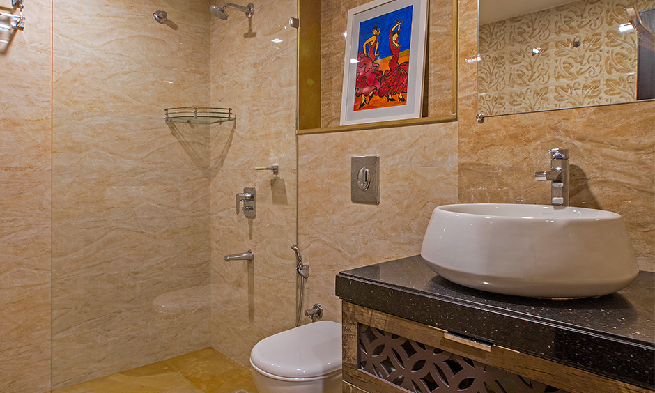 Basement bathroom with a shower area separated by a transparent glass partition